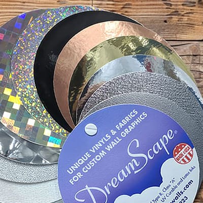 Series of blueprints and pattern swatches on a desk