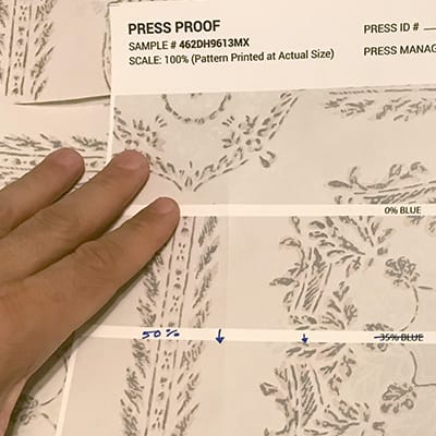 Printed sample being reviewed for quality and color accuracy