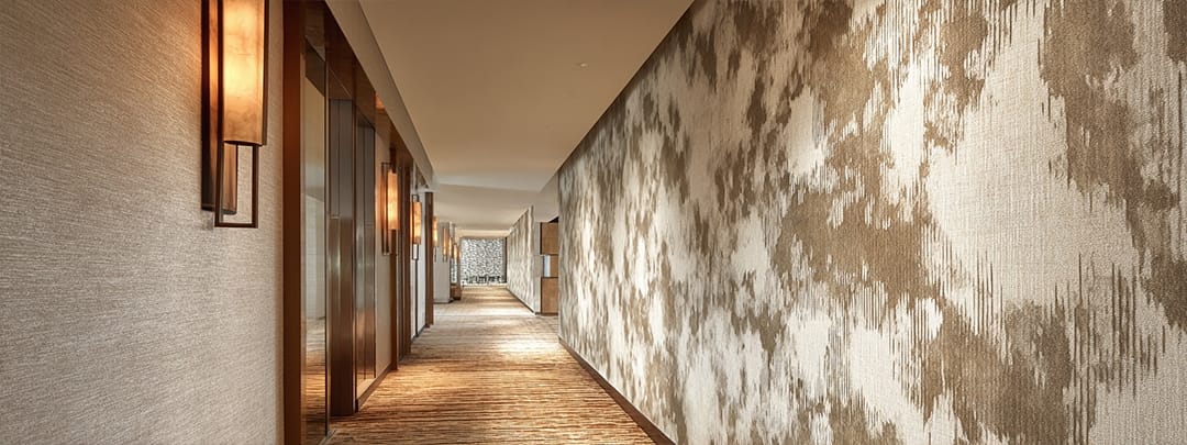 Printed grasscloth texture creating organic warmth for $12/sqft versus $40-80/sqft for real grasscloth